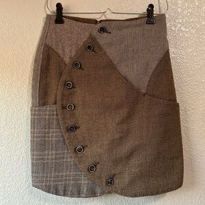 Kapital wool plaid skirt with zipper closure, functional buttons and pockets.